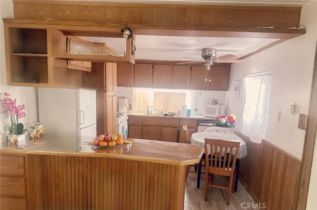 a bathroom with a sink a toilet and shower curtain