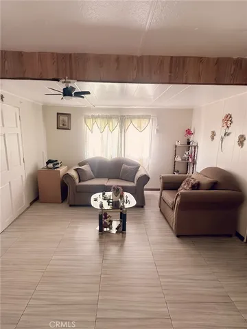 a kitchen with a refrigerator a stove a sink and a dishwasher with wooden floor