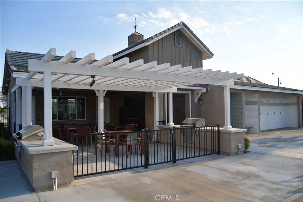 5233 Saloon Street Hemet, CA 92545 - Photo 18 of 28 a view of a house with glass door and deck