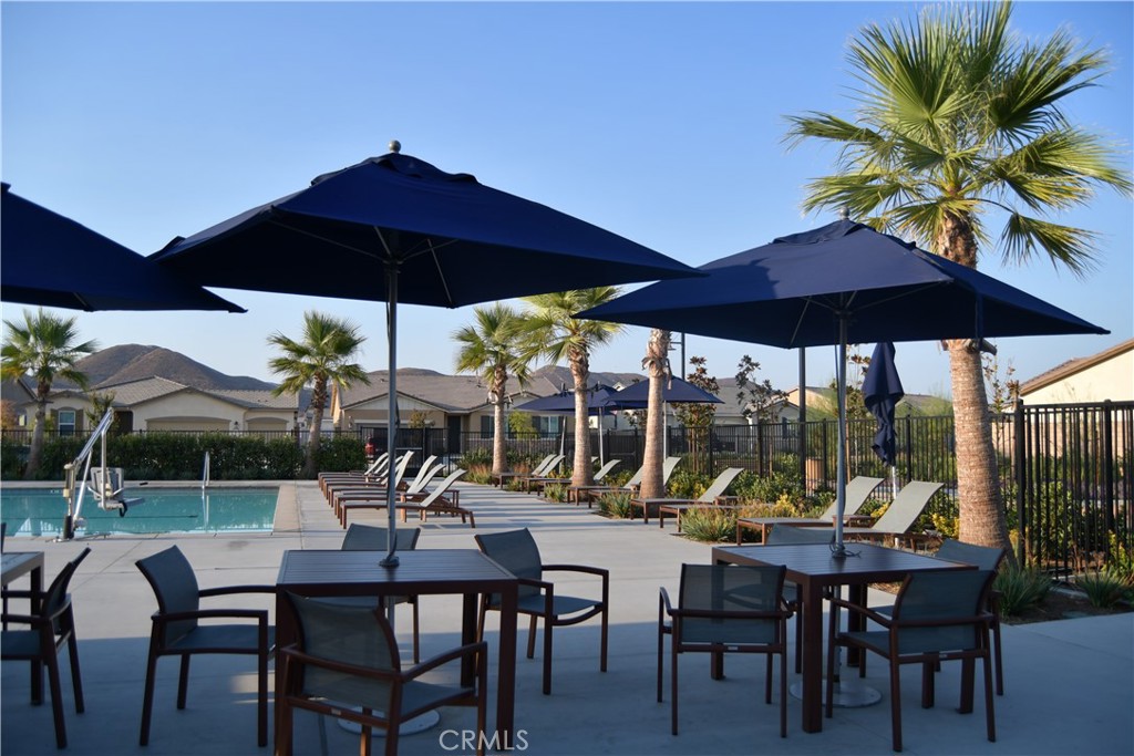 5233 Saloon Street Hemet, CA 92545 - Photo 23 of 28 a view of chairs and table under an umbrella
