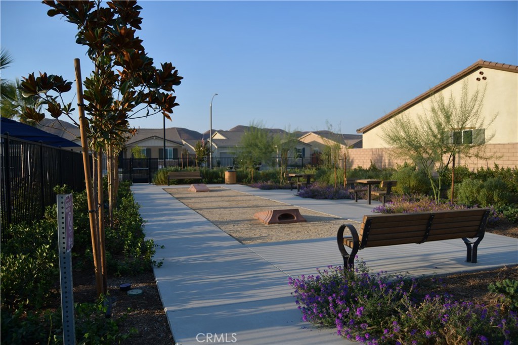 5233 Saloon Street Hemet, CA 92545 - Photo 26 of 28 a view of a patio with couches and table with potted plants