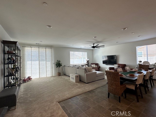 5233 Saloon Street Hemet, CA 92545 - Photo 7 of 28 a living room with furniture potted plant and a window