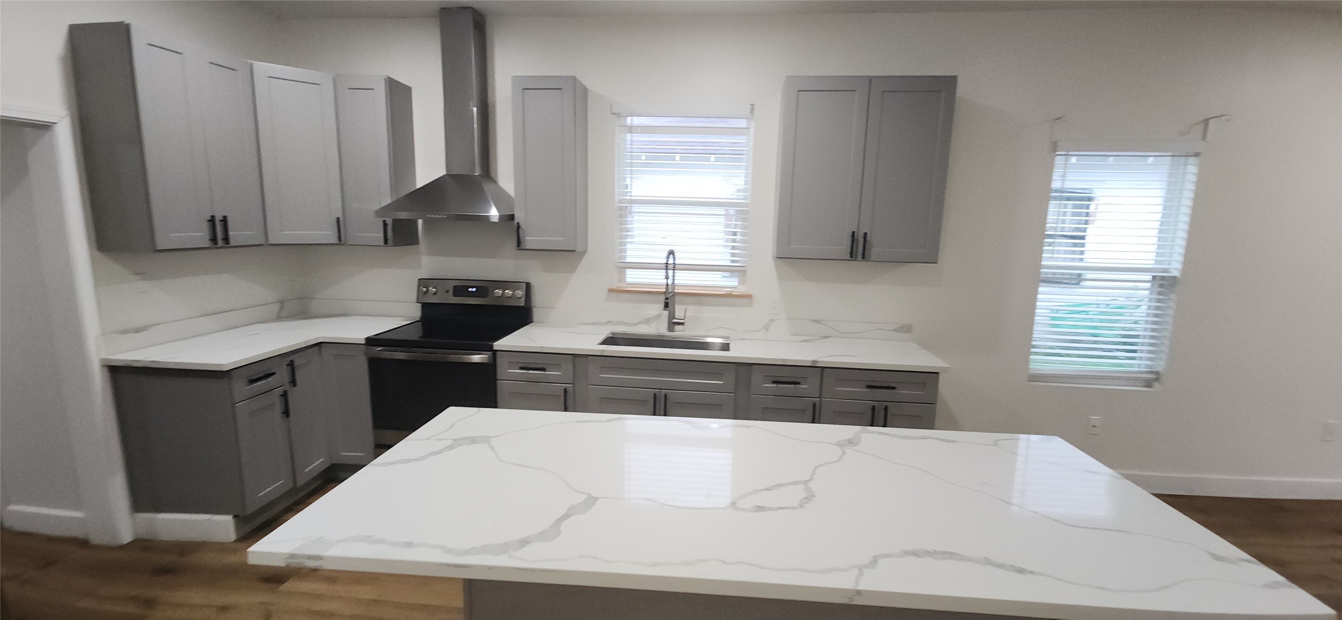 2304 Chapman Street, Unit 3 Houston, TX 77009 - Photo 13 of 17 a kitchen with stainless steel appliances a sink stove and cabinets