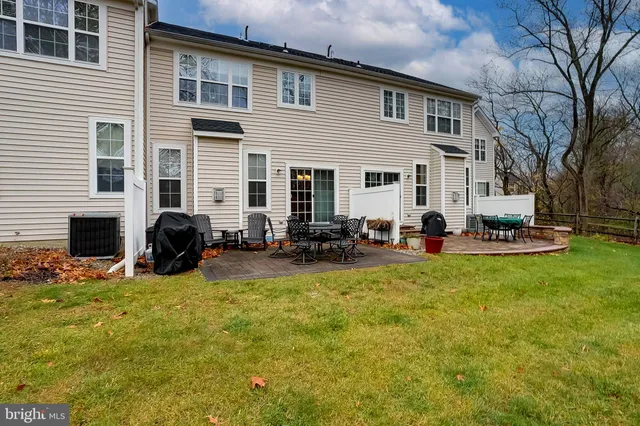 a view of a house with a backyard and a flat tv