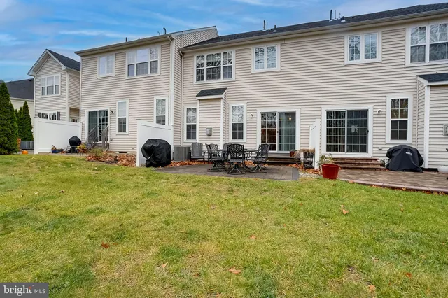 a view of a chairs and table on the patio