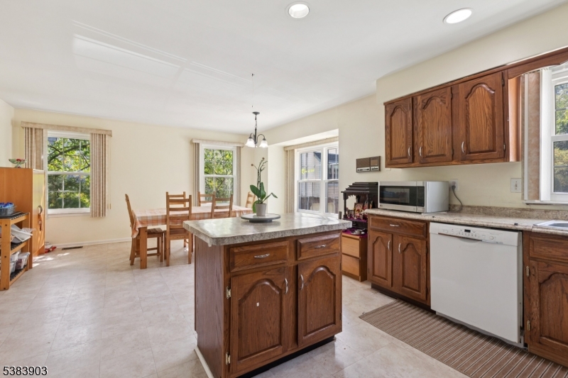 3606 Springbrook Drive Edison, NJ 08820 - Photo 16 of 25 a kitchen with stainless steel appliances granite countertop sink stove top oven and cabinets