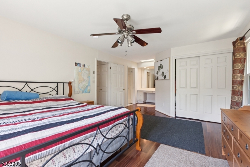 3606 Springbrook Drive Edison, NJ 08820 - Photo 18 of 25 a bedroom with a bed and wooden floor
