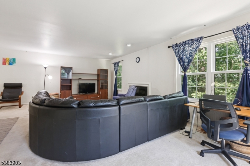 3606 Springbrook Drive Edison, NJ 08820 - Photo 7 of 25 a living room with furniture a flat screen tv and a large window
