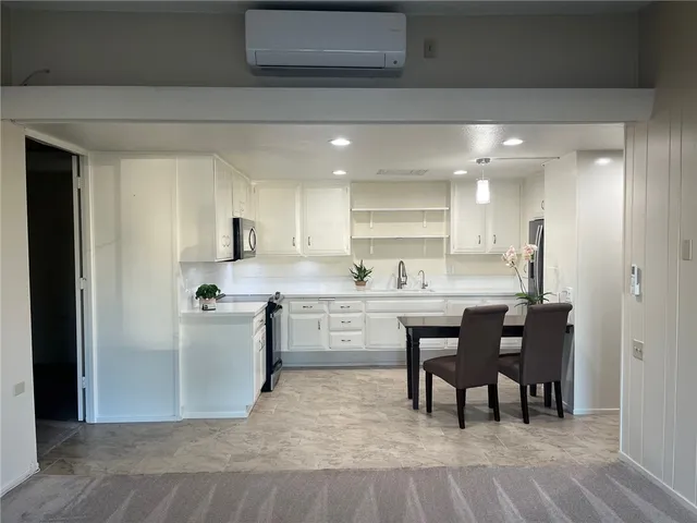 a kitchen with appliances and cabinets