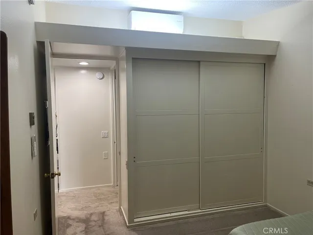 a bathroom with a glass door shower and a sink