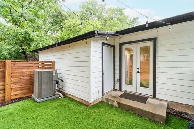 a view of a backyard with a tub and garden