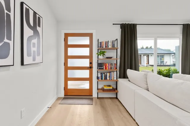 a living room with furniture and a window