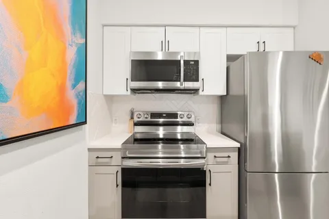 a kitchen with a stove and a microwave