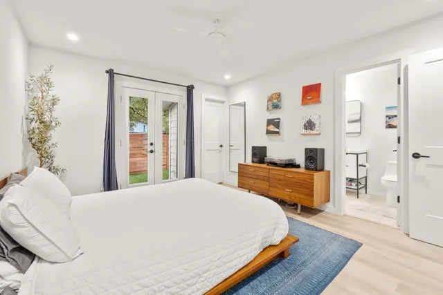 a bedroom with a bed and a dresser