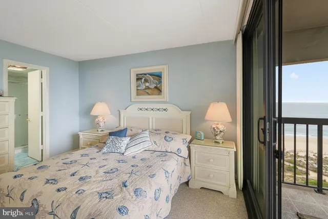 a bedroom with a bed and a closet with mirror