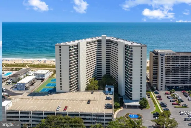 a view of ocean with a multi story building