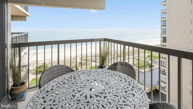 a bedroom with a bed and a large window with outer view