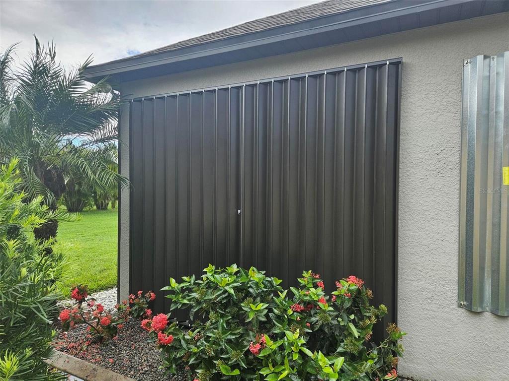 2137 Apian Way Port Charlotte, FL 33953 - Photo 5 of 25 a wooden fence with some flowers