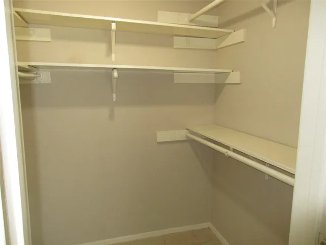 a view of an empty walk in closet