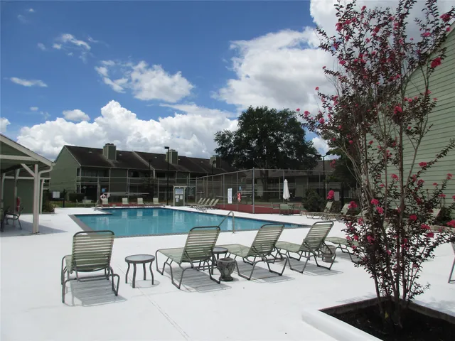 a view of a backyard with sitting area and furniture
