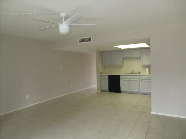 a view of a kitchen with a sink and dishwasher