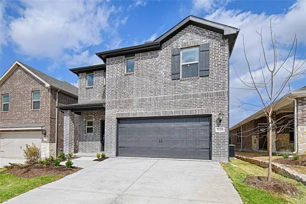 a front view of a house with garage