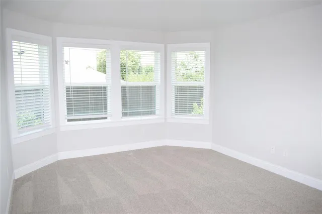 a kitchen with a sink a stove and cabinets