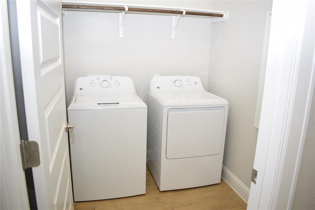2605 Sam Bass Road, Unit 25 Round Rock, TX 78681 - Photo 16 of 25 a utility room with dryer and washer