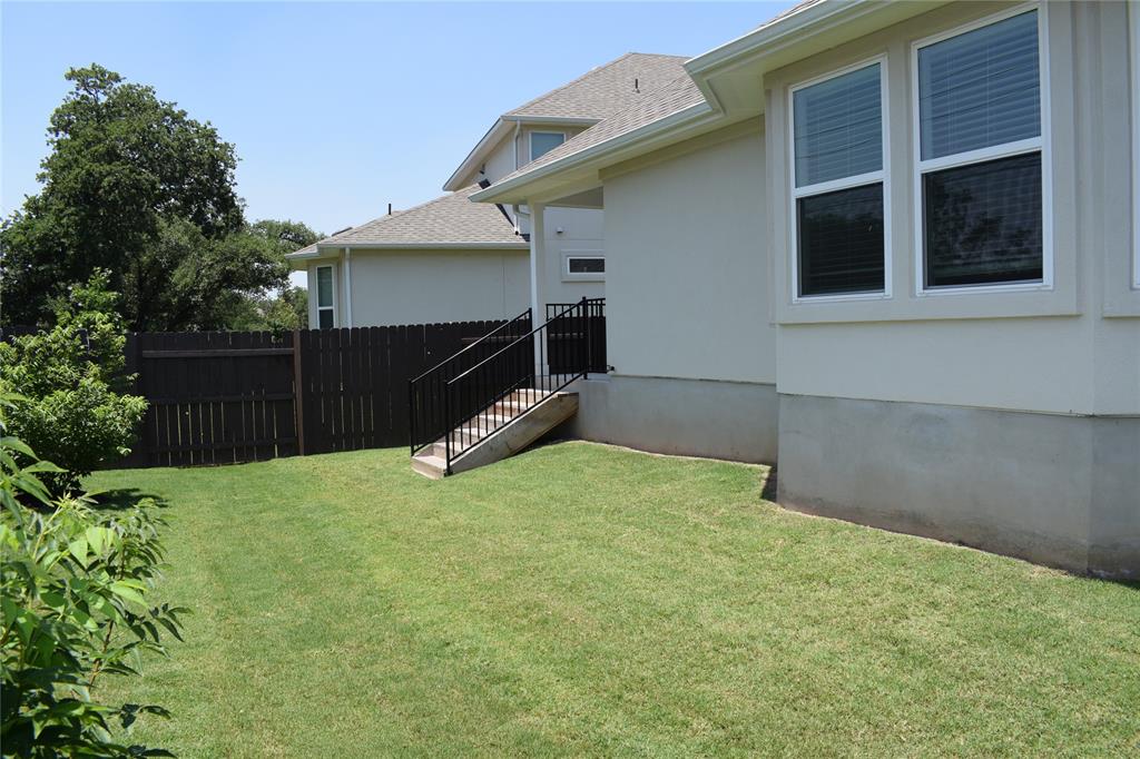 2605 Sam Bass Road, Unit 25 Round Rock, TX 78681 - Photo 22 of 25 a backyard of a house with barbeque oven and a stove
