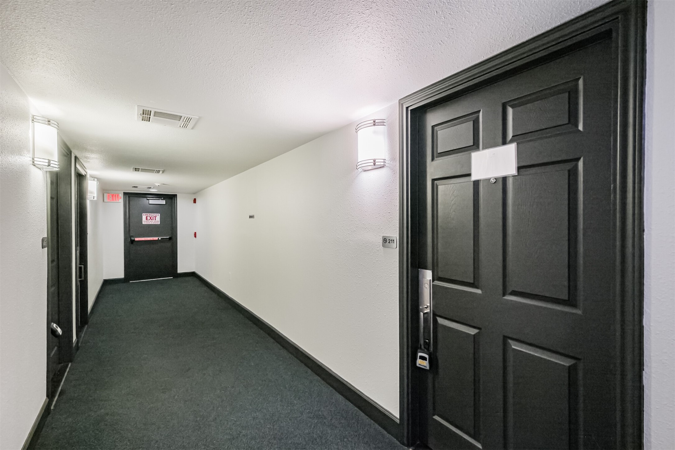 1025 Swanson Street, Unit 211 Houston, TX 77030 - Photo 8 of 18 a view of a hallway