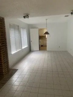 a view of a kitchen with furniture and window