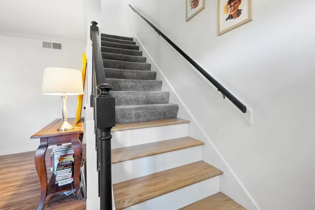 a view of entryway and hall with wooden floor