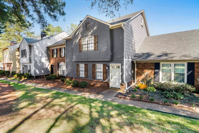 a front view of a house with garden