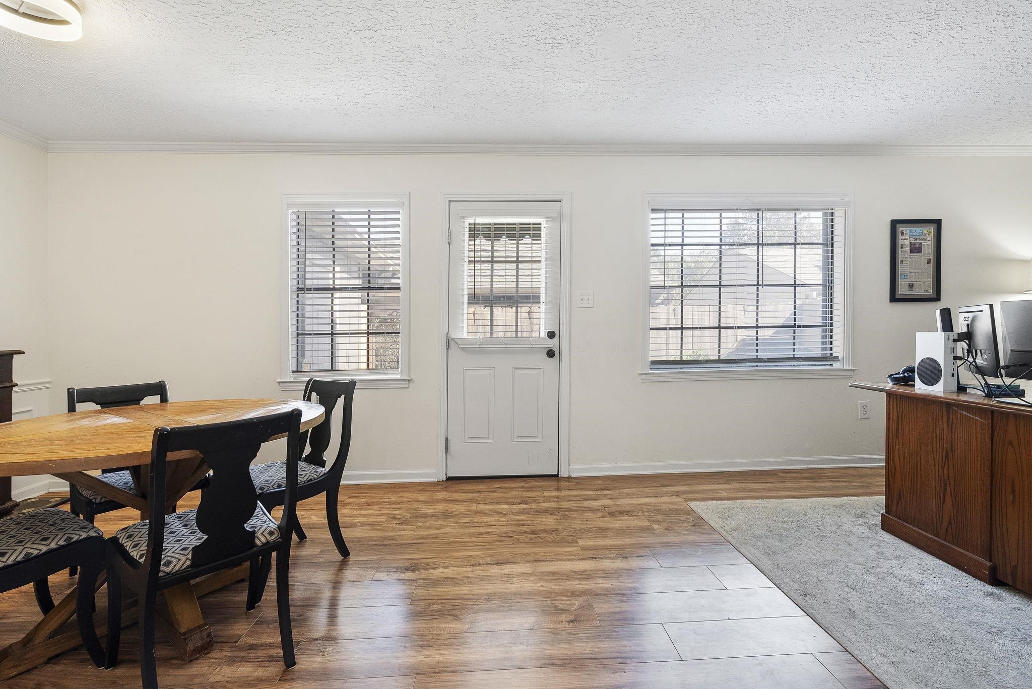 6997 Fords Station Road, Unit 16 Germantown, TN 38138 - Photo 10 of 36 a view of a dining room with furniture and window