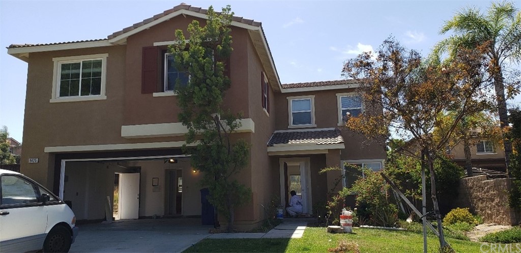 9425 Hampstead Court Riverside, CA 92508 - Photo 1 of 1 a front view of a house with garden