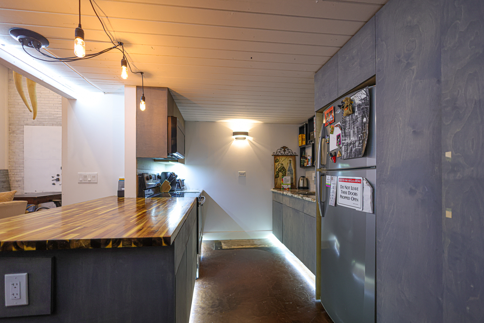40 North Tower Road, Unit 1E Oak Brook, IL 60523 - Photo 4 of 15 a kitchen with stainless steel appliances granite countertop a sink and refrigerator