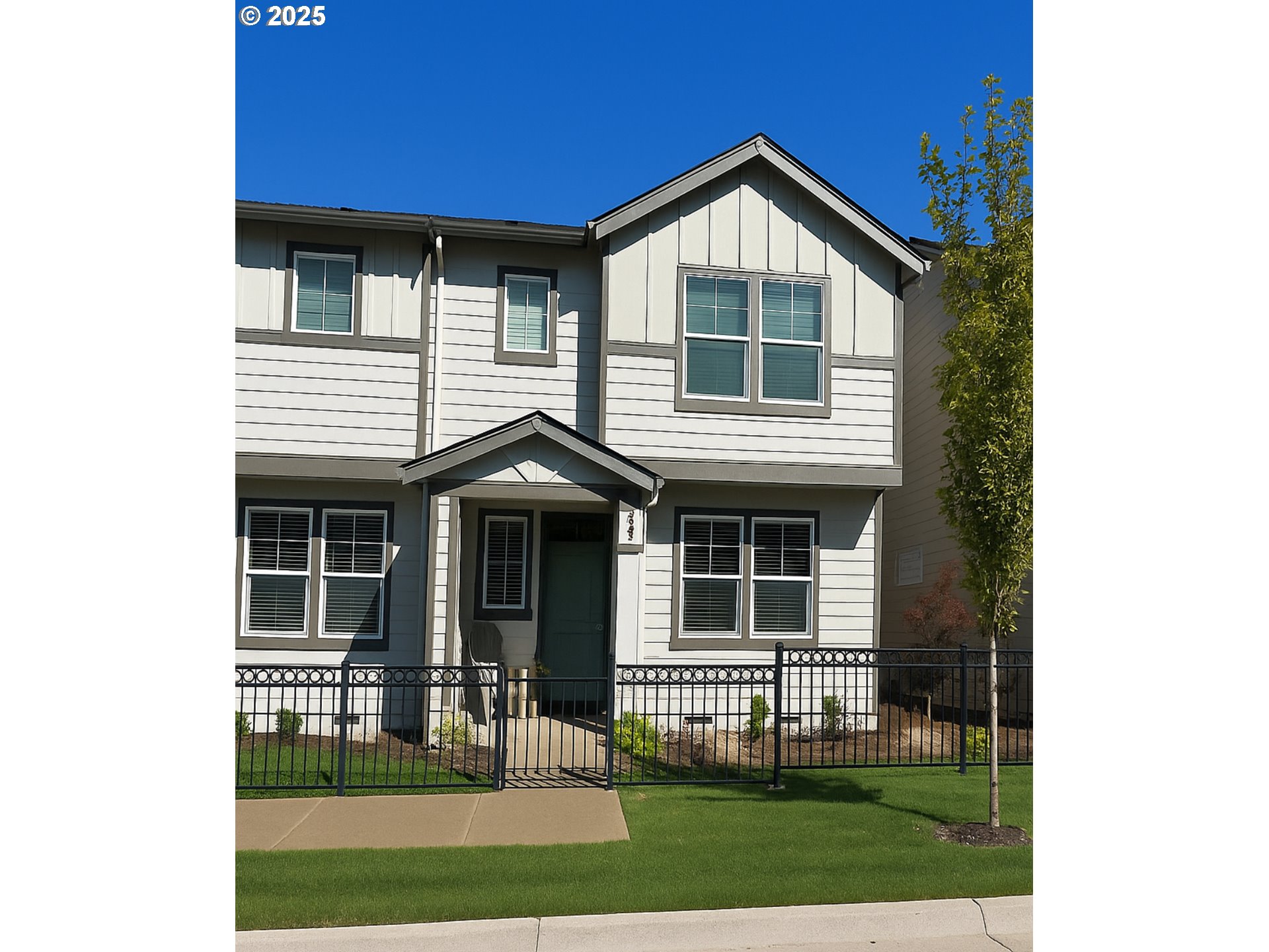 a front view of a house with a yard