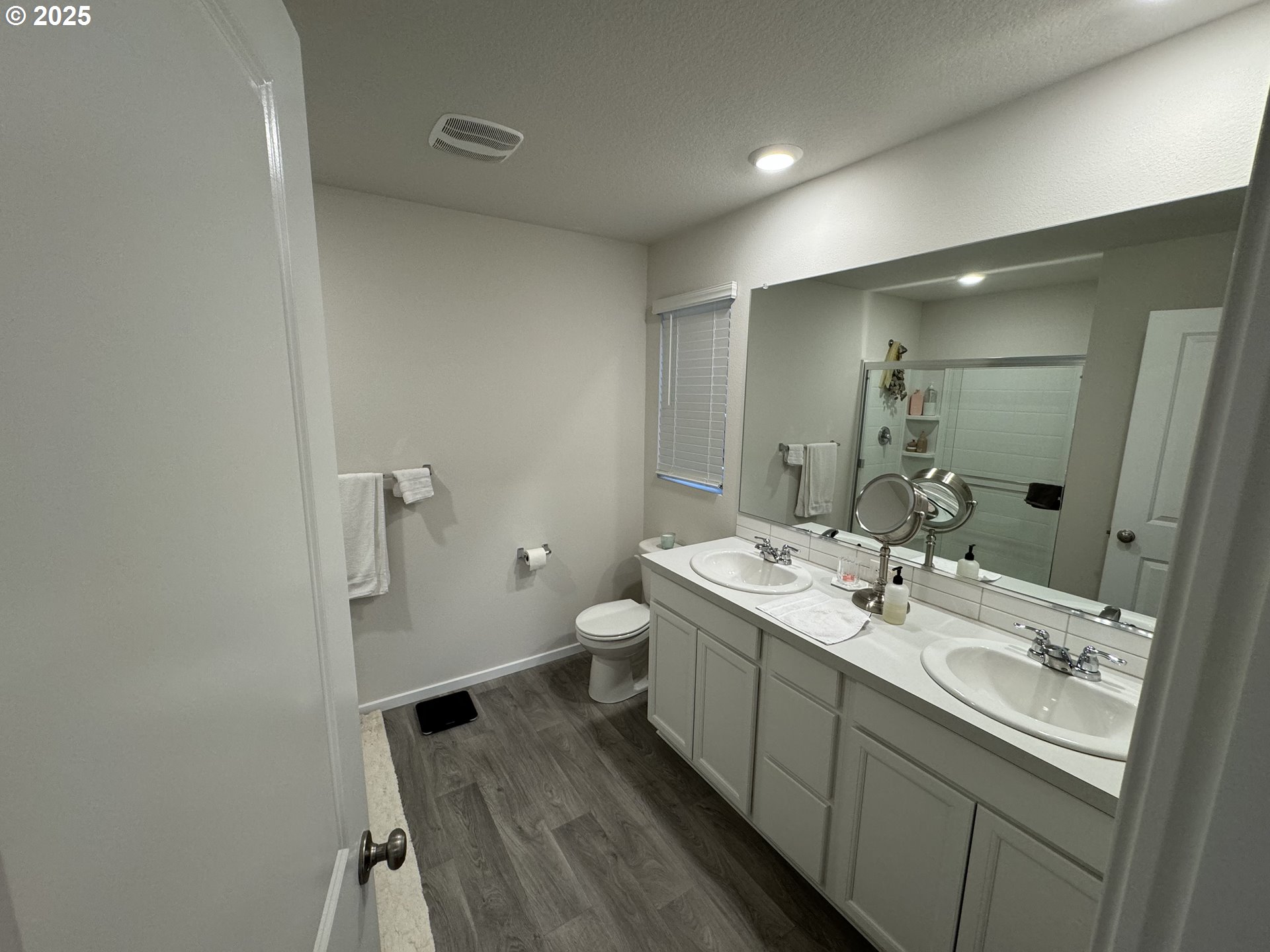 861 North 19th Avenue Cornelius, OR 97113 - Photo 11 of 15 a spacious bathroom with a double vanity sink toilet and mirror