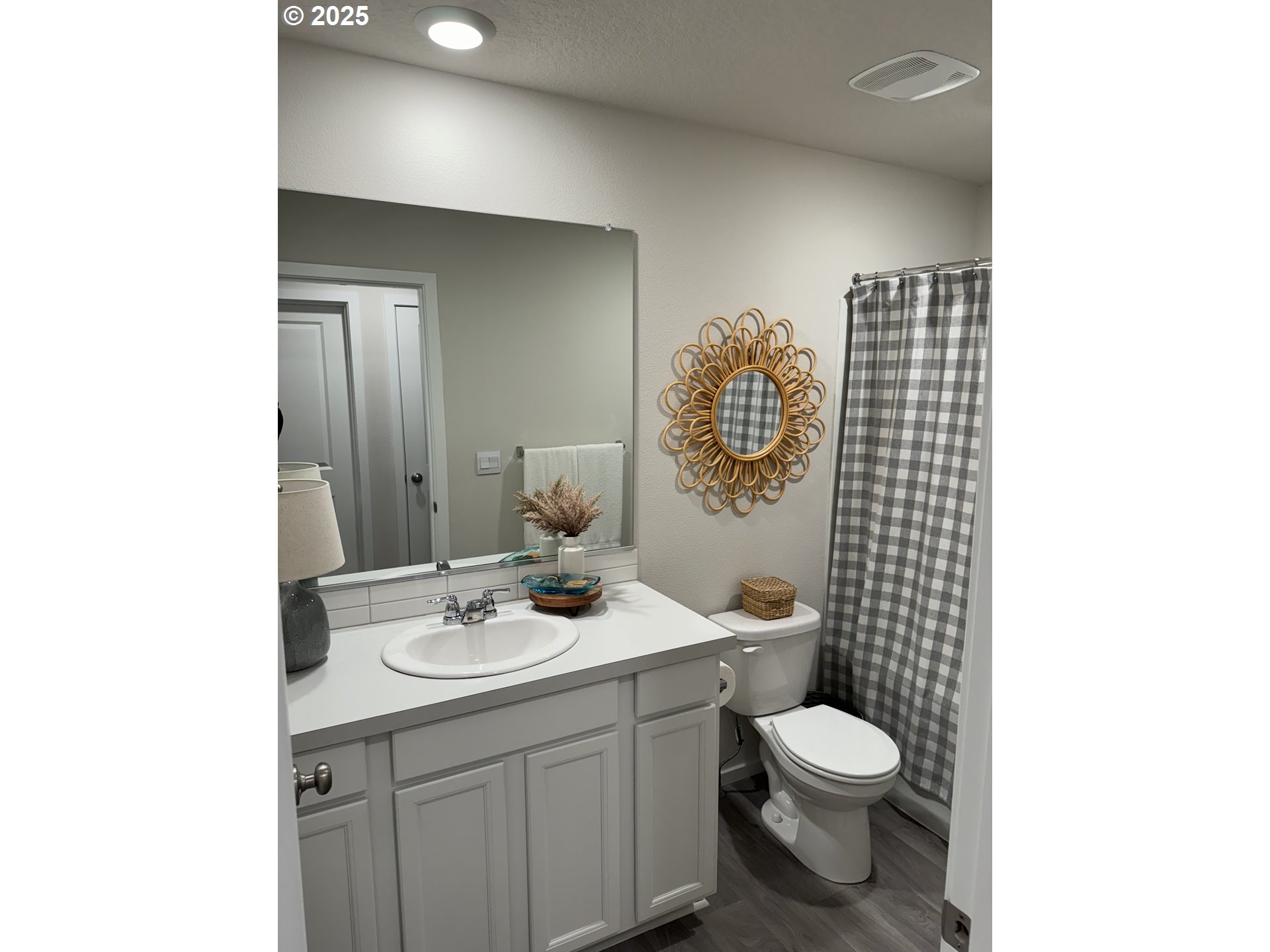 861 North 19th Avenue Cornelius, OR 97113 - Photo 13 of 15 a bathroom with a toilet a sink and mirror
