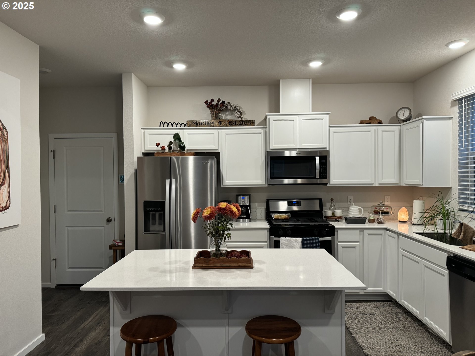 861 North 19th Avenue Cornelius, OR 97113 - Photo 7 of 15 a kitchen with stainless steel appliances a sink a stove a refrigerator and cabinets