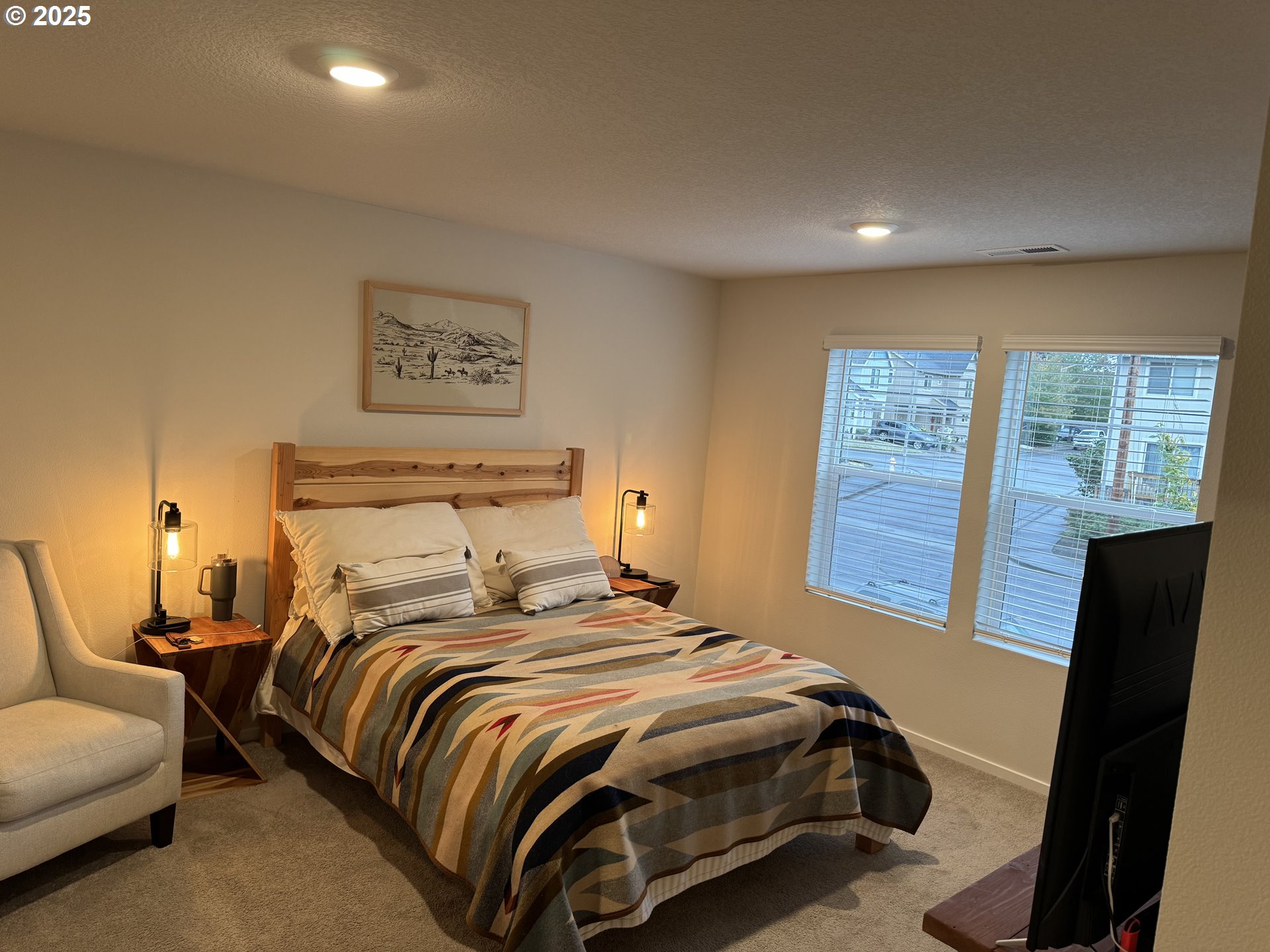 861 North 19th Avenue Cornelius, OR 97113 - Photo 10 of 15 a bedroom with a bed and wooden floor