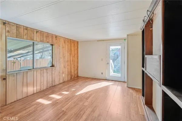 a view of hallway with wooden floor