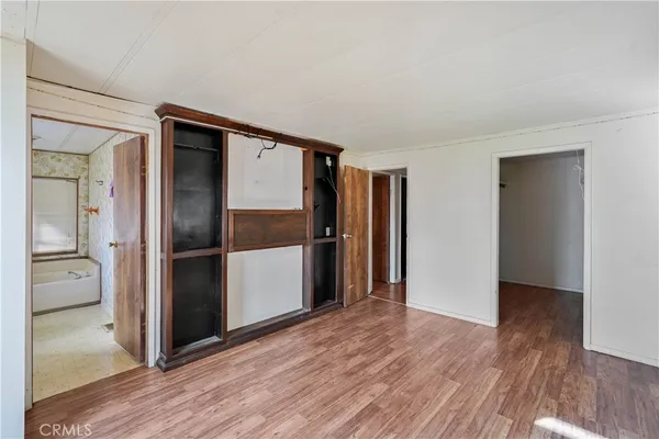 a view of a refrigerator in kitchen and wooden floor