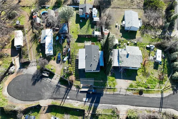 an aerial view of a house with outdoor space