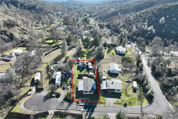 an aerial view of houses with outdoor space