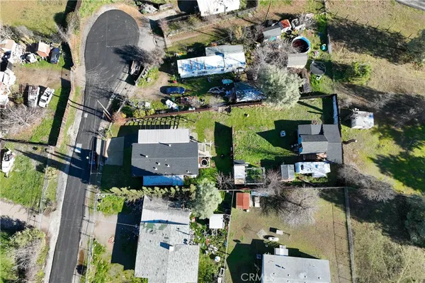 an aerial view of houses with outdoor space