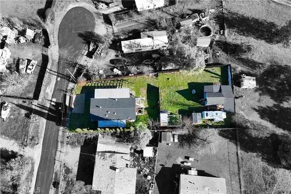 an aerial view of houses with outdoor space