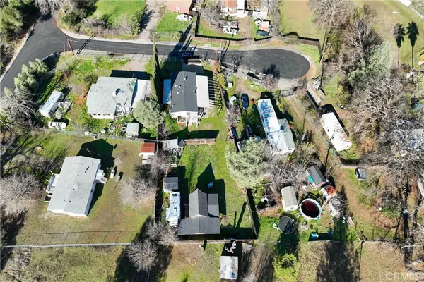 an aerial view of houses with outdoor space
