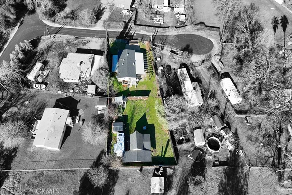an aerial view of residential houses with outdoor space