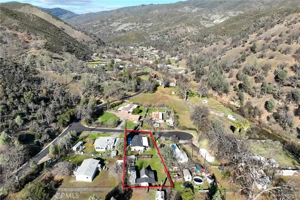 an aerial view of houses with outdoor space